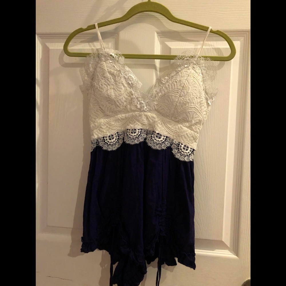 Luxxel off white and blue romper top is lace with spaghetti straps